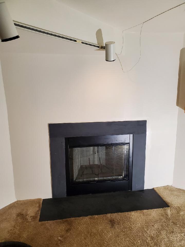 Woodburning factory built fireplace by Trinity Chimney